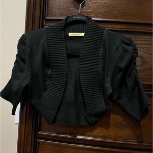 Beautifully made black shrug in excellent quality.